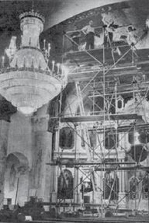 scaffolding fills the church as Bicenko and his assistants work on the murals